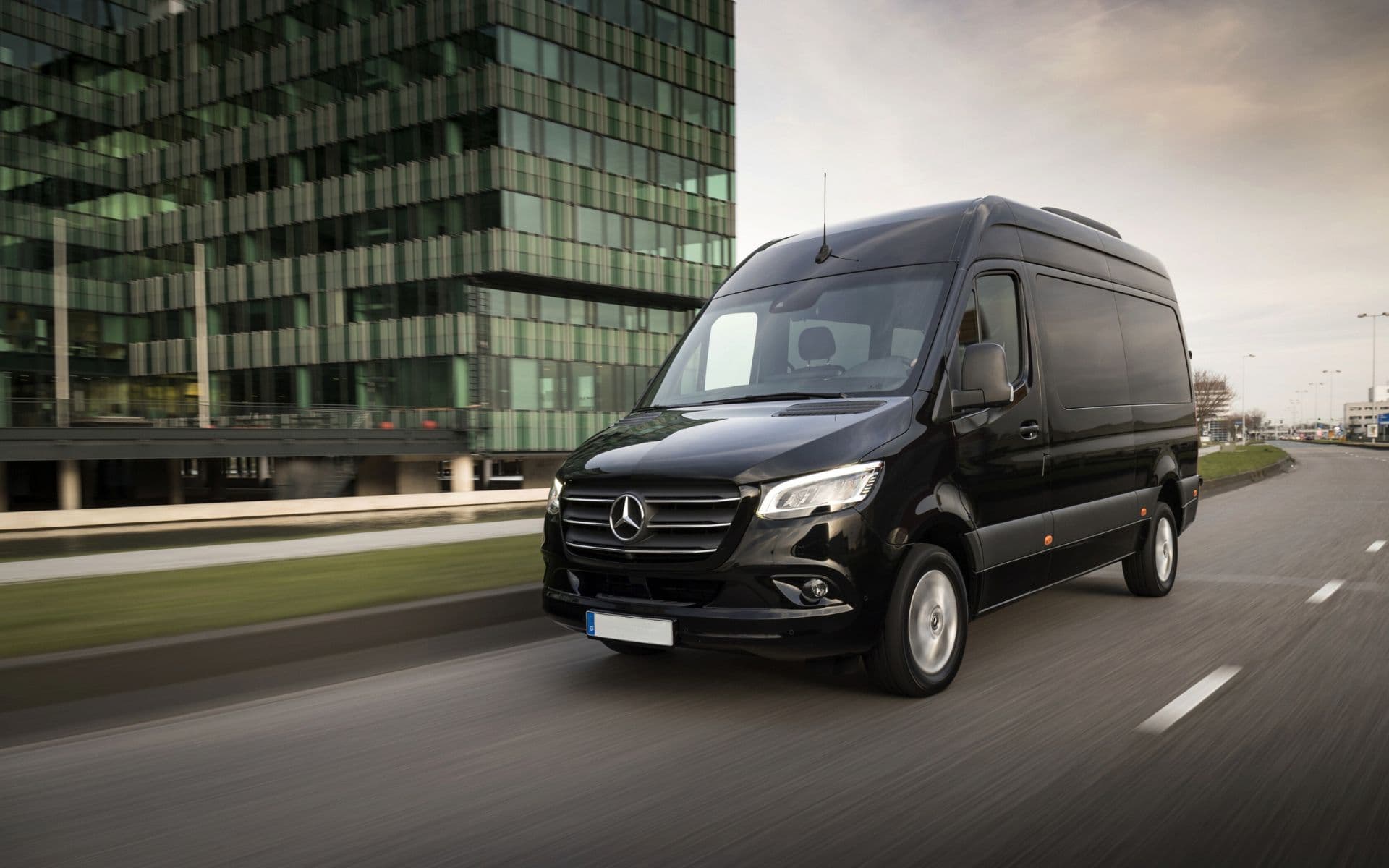 AJ Executive Travel luxury minibus on the road